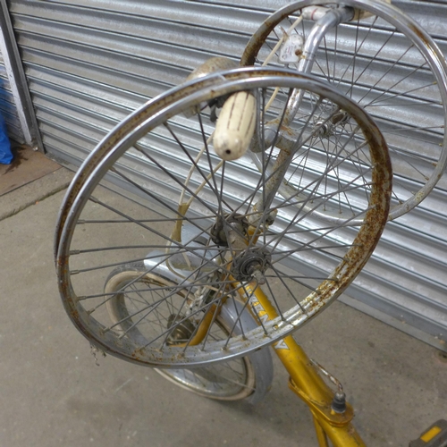 5168 - A vintage Raleigh Twenty folding bike with three spare wheels, front headlight, pannier rack and mud... 