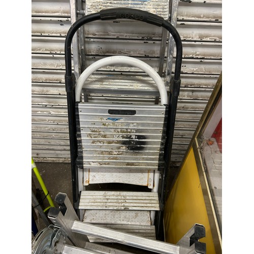 5175 - Four sets of ladders including a 5 rung aluminium step ladder, a set of 2 rung metal steps, a set of... 