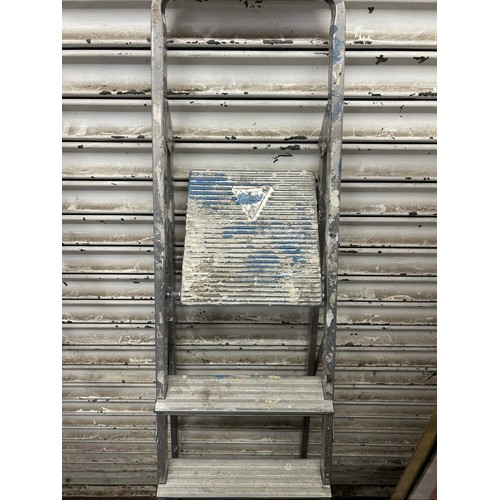 5175 - Four sets of ladders including a 5 rung aluminium step ladder, a set of 2 rung metal steps, a set of... 