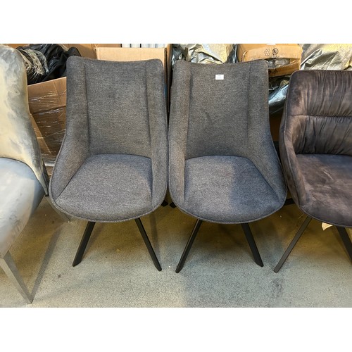 3305 - A pair of charcoal swivel dining chairs *This lot is subject to VAT