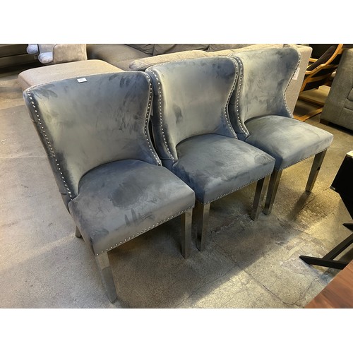 3314 - A set of three grey velvet marvel chrome dining chairs *This lot is subject to VAT