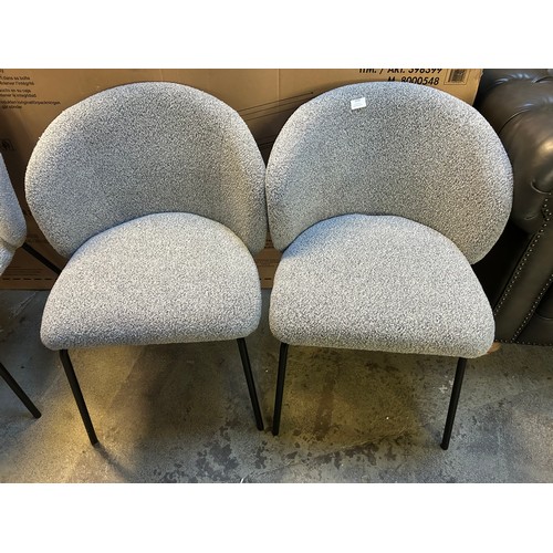 3319 - A pair of light grey boucle dining chairs *This lot is subject to VAT