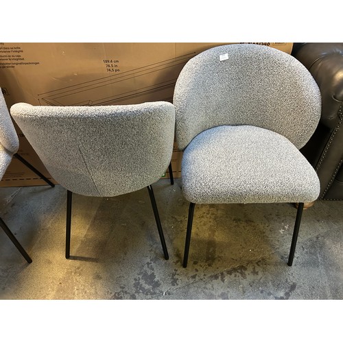 3319 - A pair of light grey boucle dining chairs *This lot is subject to VAT