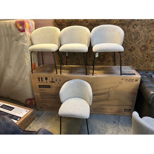 3320 - A set of four cream boucle dining chairs *This lot is subject to VAT