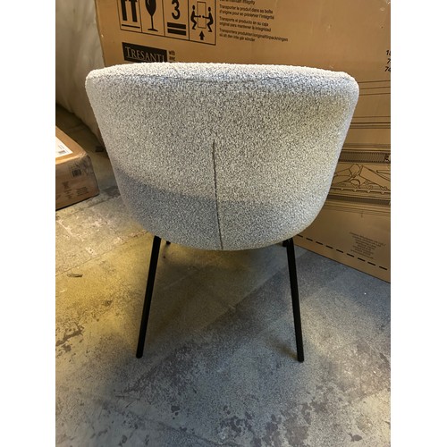 3320 - A set of four cream boucle dining chairs *This lot is subject to VAT