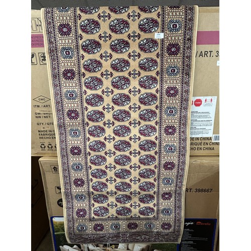 3079 - A Bokhara style gold ground anti-slip runner rug