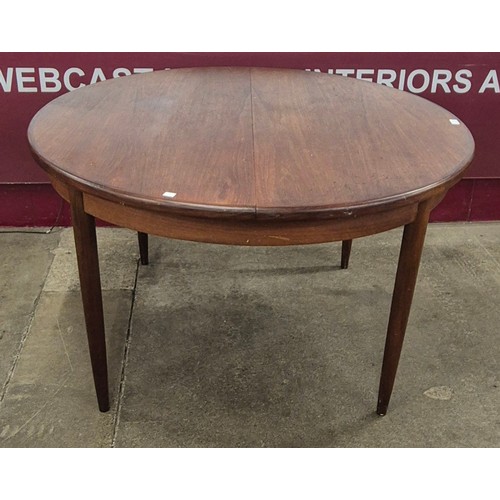 12 - A G-Plan Fresco teak circular extending dining table and four chairs