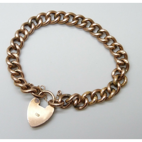 7001 - A 9ct gold gate bracelet with embossed design links, 10.5g