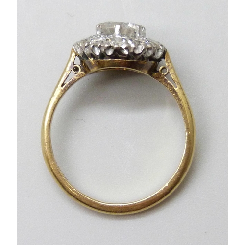 7006 - An 18ct gold and diamond ring, central diamond approximately 0.75ct, 4.2g, P