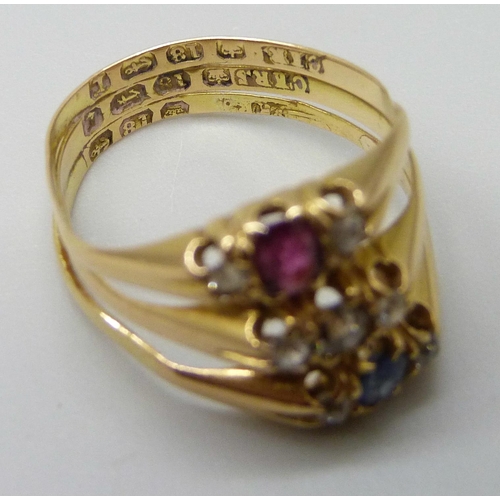 7007 - An 18ct gold ring set with ruby, sapphire and diamonds, 4.2g, K