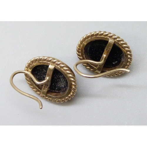 7017 - A pair of 9ct gold earrings set with black cabochon stones, 5.1g, 1.5cm