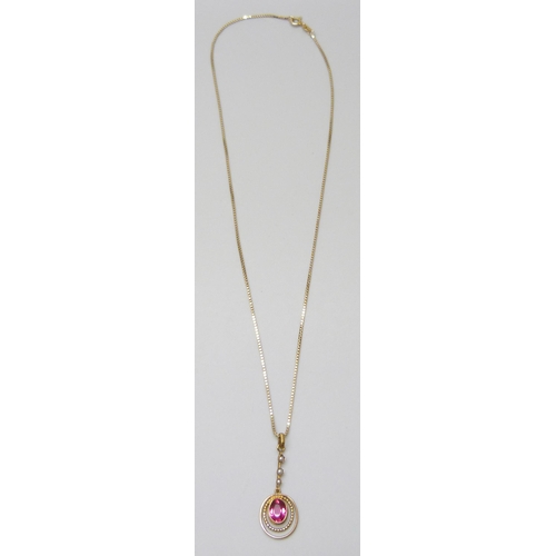 7020 - A gilt metal Edwardian drop pendant set with a paste stone and seed pearls, 3cm, on a 14ct gold chai... 