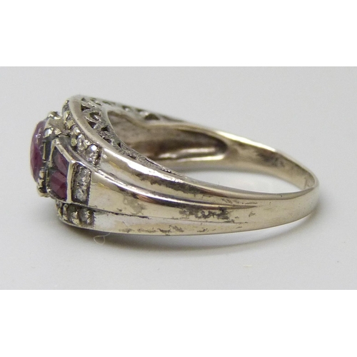 7021 - A white metal, ruby and diamond ring, stamped 750, 4.6g, O