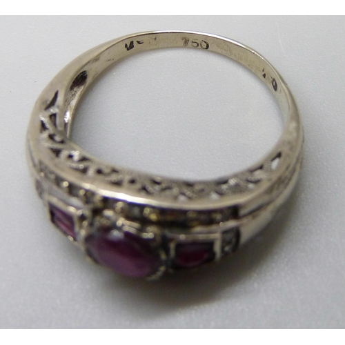 7021 - A white metal, ruby and diamond ring, stamped 750, 4.6g, O