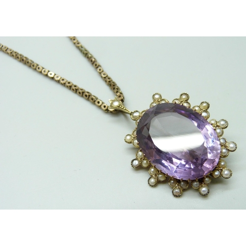 7030 - An amethyst and half seed pearl pendant, 3.4cm, stone  1.8 x 2.3cm, together with a 9ct gold chain, ... 