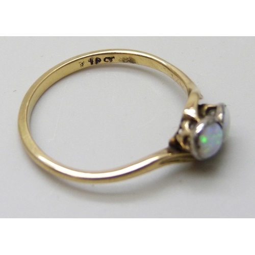 7031 - A yellow metal two stone opal ring, stamped 18ct, 2.2g, P