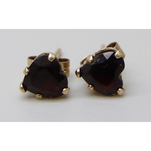 7037D - A pair of 9ct gold and garnet earrings in the form of hearts, butterflies marked 9ct, 0.6g, 5mm