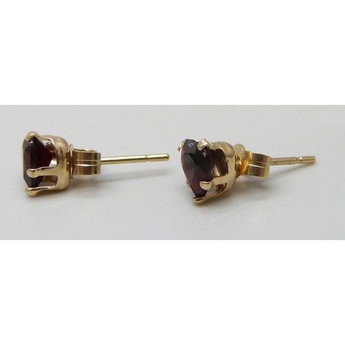 7037D - A pair of 9ct gold and garnet earrings in the form of hearts, butterflies marked 9ct, 0.6g, 5mm