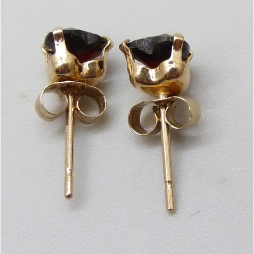 7037D - A pair of 9ct gold and garnet earrings in the form of hearts, butterflies marked 9ct, 0.6g, 5mm