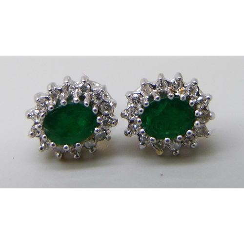 7037F - A pair of hallmarked 9ct gold, diamond and emerald cluster earrings, 1.6g, 8mm