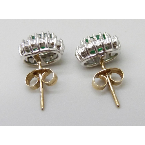 7037F - A pair of hallmarked 9ct gold, diamond and emerald cluster earrings, 1.6g, 8mm