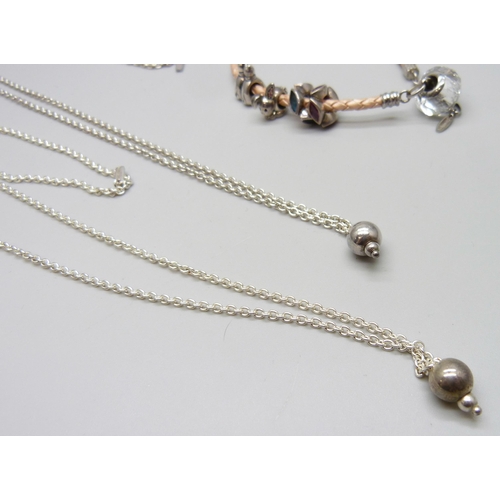 7040 - Two silver Chamilia necklaces together with a silver mounted leather Chamilia bracelet with four Cha... 