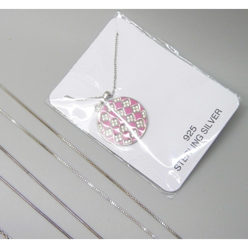 7044 - A collection of silver pendants and chains, and a plated pendant in packet, 28g