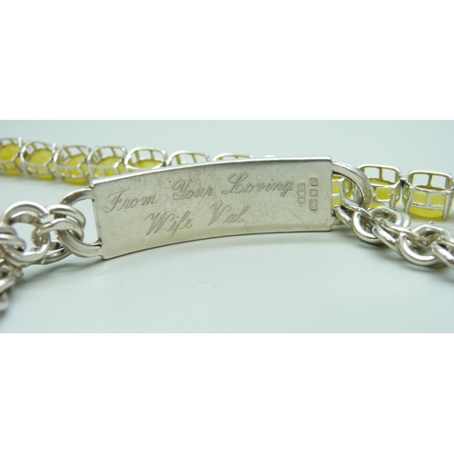 7051 - A silver ID bracelet, 21.5cm, a silver yellow quartz set tennis bracelet, 20cm, a large silver and r... 