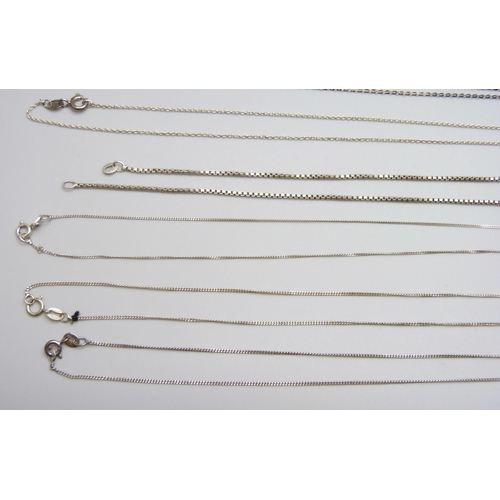 7060 - A collection of silver and white metal pendants and chains, 65g, together with a plated chain and a ... 