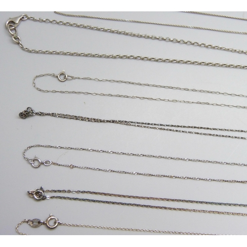 7060 - A collection of silver and white metal pendants and chains, 65g, together with a plated chain and a ... 