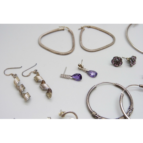 7064 - A collection of silver earrings, 52g, five pairs of unmarked white metal earrings, a pair of costume... 