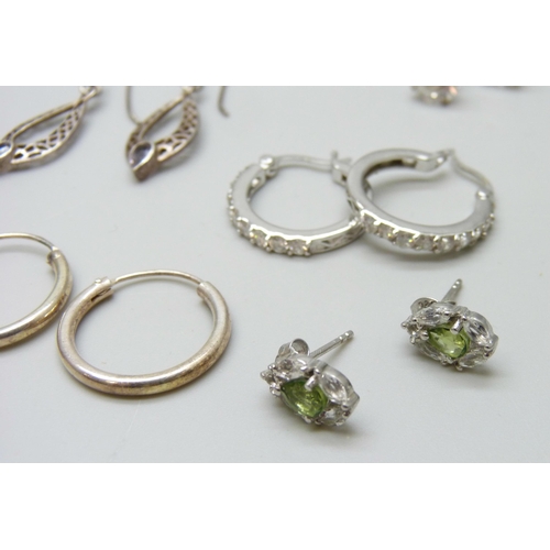 7064 - A collection of silver earrings, 52g, five pairs of unmarked white metal earrings, a pair of costume... 