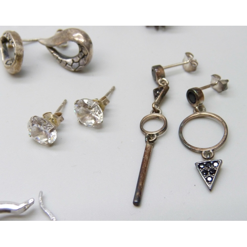 7064 - A collection of silver earrings, 52g, five pairs of unmarked white metal earrings, a pair of costume... 