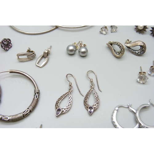 7064 - A collection of silver earrings, 52g, five pairs of unmarked white metal earrings, a pair of costume... 