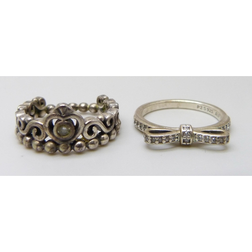 7067 - Two silver Pandora rings, both size L, and a pair of silver Pandora earrings