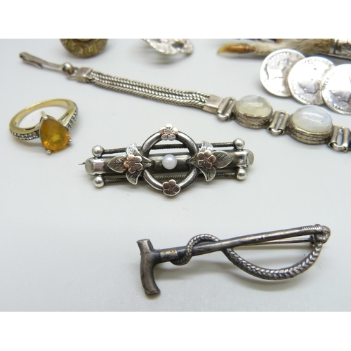 7070 - A silver set moonstone bracelet, two silver buttons, a Victorian silver bar brooch, a silver gilt ri... 