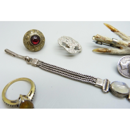 7070 - A silver set moonstone bracelet, two silver buttons, a Victorian silver bar brooch, a silver gilt ri... 