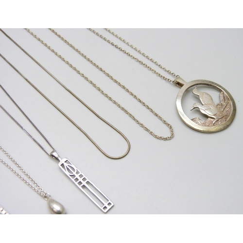 7075 - A collection of silver pendants and chains including a Malcolm Gray bird pendant, 39g, together with... 