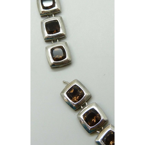 7085 - A silver and smoky quartz necklace, (requires repair in two places - detached on both sides), 37g