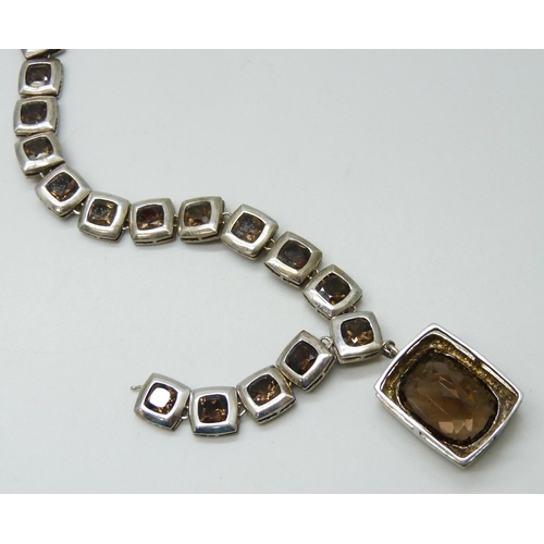 7085 - A silver and smoky quartz necklace, (requires repair in two places - detached on both sides), 37g