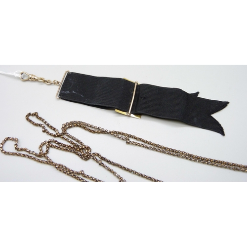 7094 - A Victorian gold filled long guard chain, together with a rolled gold buckle/dog clip ribbon, 130cm ... 