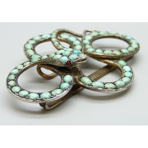 7095 - A turquoise set buckle in the form of a snake, 6.5cm, together with a turquoise set adornment