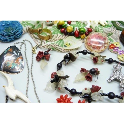 7107 - A collection of plastic and other vintage jewellery including The Beatles Paul McCartney guitar broo... 