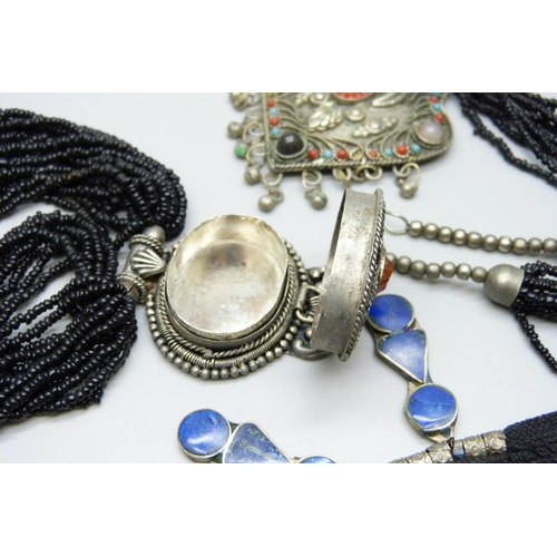 7116 - Four Eastern style necklaces including one set with lapis lazuli