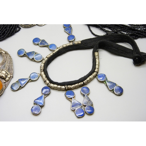 7116 - Four Eastern style necklaces including one set with lapis lazuli