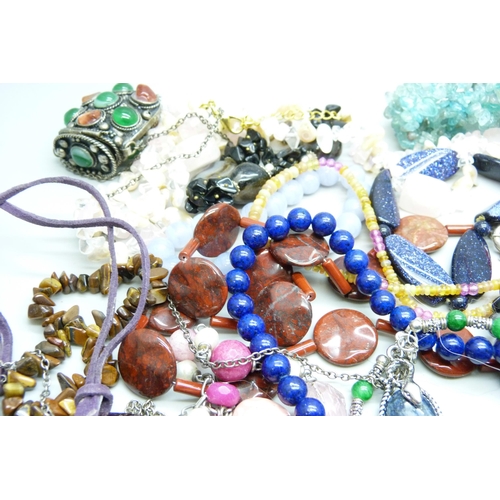 7118 - A collection of gemstone jewellery including silver mounted