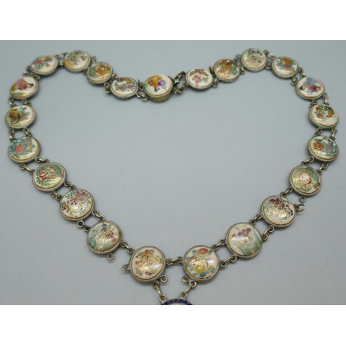 7119 - An early 20th Century Oriental drop necklace with hand painted ceramic panels, some links a/f, 40cm,... 