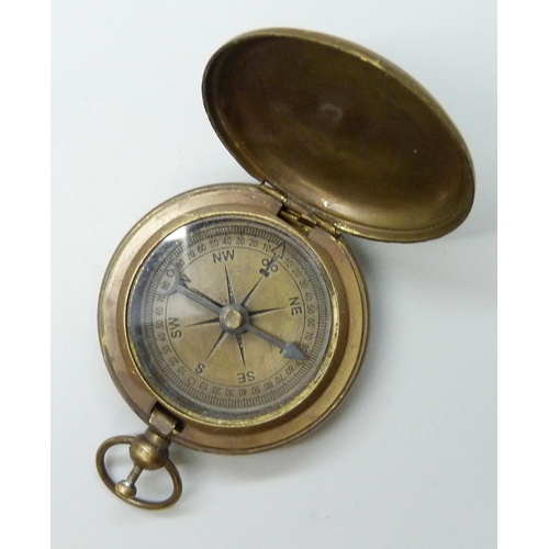 7140 - A 14ct gold plated pocket watch, a/f lacking cover, together with a Ross London compass