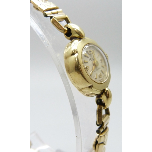 7141 - A 14ct gold cased lady's Rado wristwatch on a plated strap, 16mm case including crown