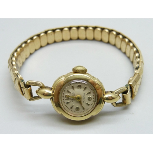 7141 - A 14ct gold cased lady's Rado wristwatch on a plated strap, 16mm case including crown